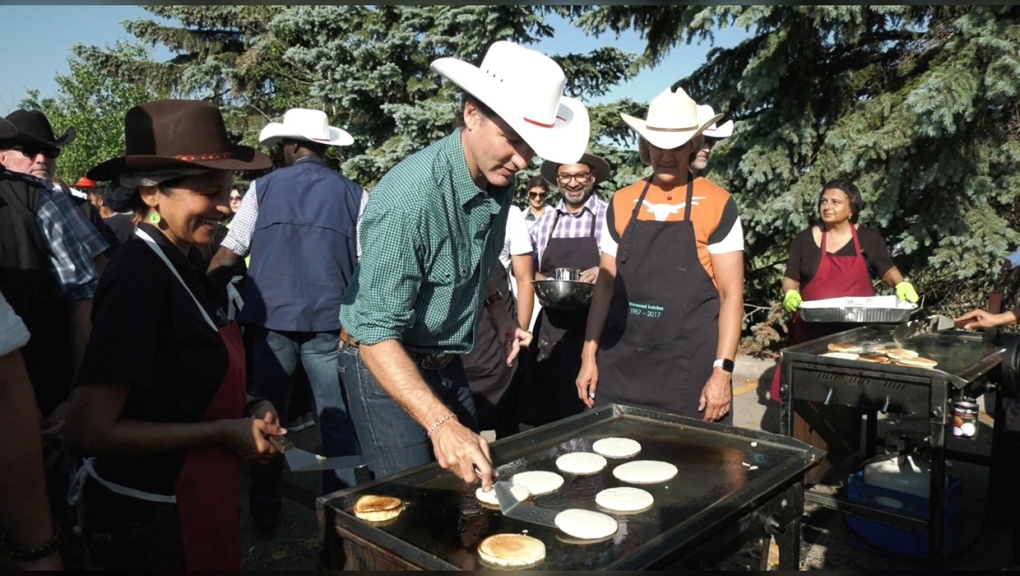 Politicians work the griddle at Stampede pancake breakfasts
